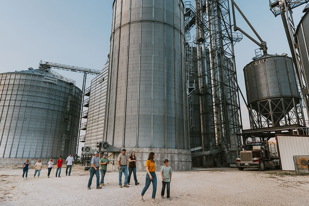 Niemeyer Family Farm walking by grain bins